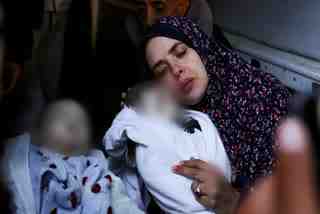 It took 10 years and three rounds of in vitro fertilization for Rania Abu Anza to become pregnant, and only seconds for her to lose her five-month-old twins, a boy and a girl.